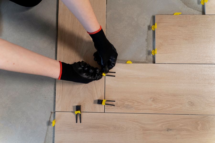 flat-lay-worker-tiling-floor